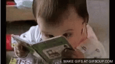 A Baby Is Reading A Book With Make Gifs At Gifsoup.com At The Bottom Of The Screen GIF