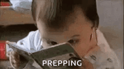 A Baby Is Reading A Book With The Word Prepping Written Next To Him . GIF