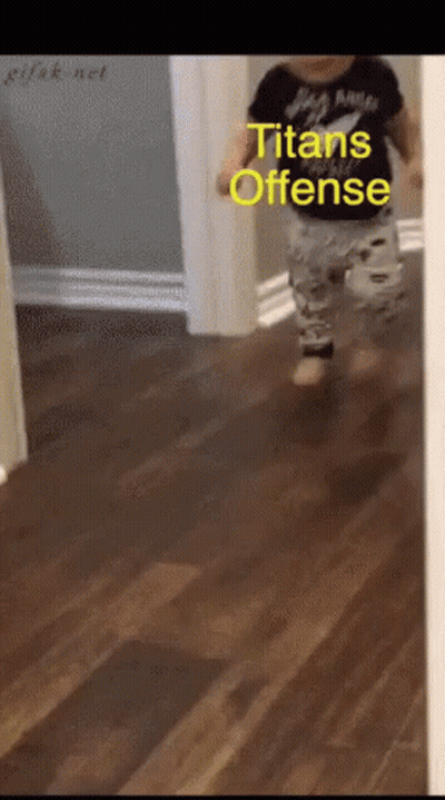 A Baby Is Running Down A Hallway With The Words Titans Offense Written On The Bottom GIF