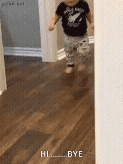A Baby Is Running On A Wooden Floor And Saying Hi Bye . GIF