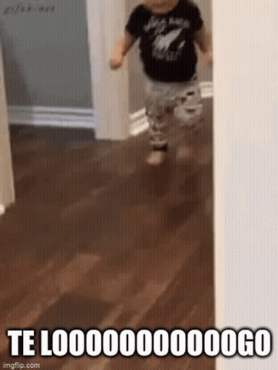 A Baby Is Running On A Wooden Floor In A Hallway With A Caption That Says Te Looo . GIF