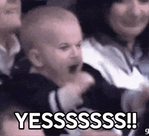 A Baby Is Screaming In A Crowd With The Words Yesssss !! Written On The Bottom GIF