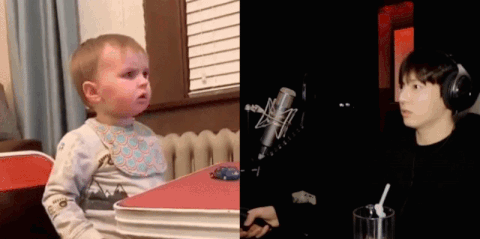 A Baby Is Sitting At A Table Next To A Boy Wearing Headphones . GIF