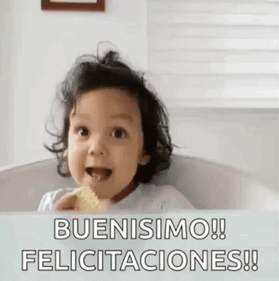 A Baby Is Sitting In A Bathtub And Eating A Cookie . GIF