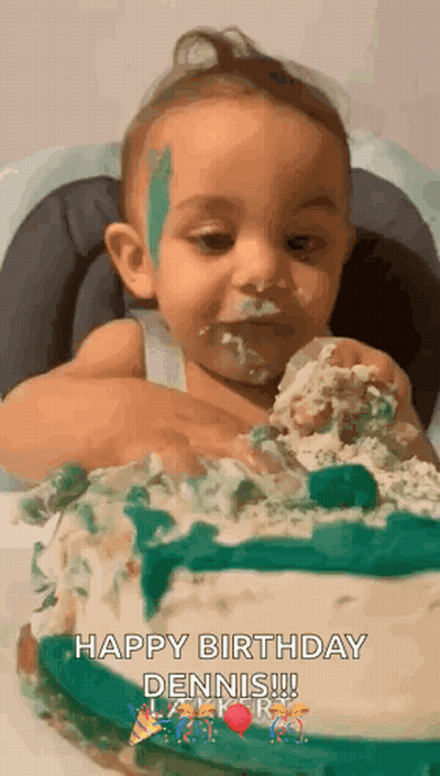 A Baby Is Sitting In A High Chair Eating A Birthday Cake With His Face Covered In Frosting . GIF