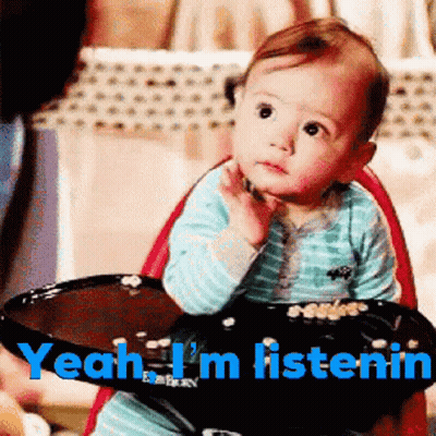 A Baby Is Sitting In A High Chair With The Words " Yeah I 'M Listenin " On The Bottom GIF