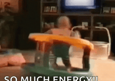 A Baby Is Sitting In A Walker In A Living Room With The Words `` So Much Energy ! '' GIF