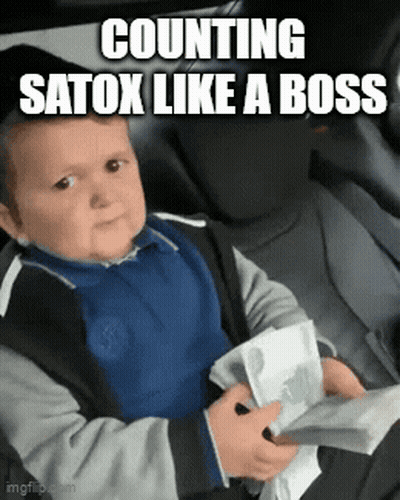 A Baby Is Sitting In The Back Seat Of A Car Holding A Bunch Of Money And Making A Funny Face . GIF