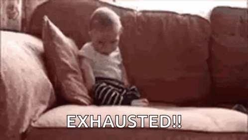 A Baby Is Sitting On A Couch With The Words `` Exhausted '' Written Above Him . GIF