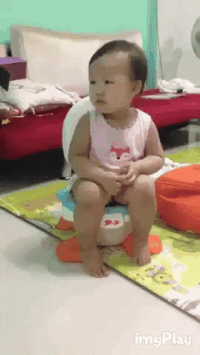 A Baby Is Sitting On A Potty In A Living Room With Imgplay Written On The Bottom Right GIF
