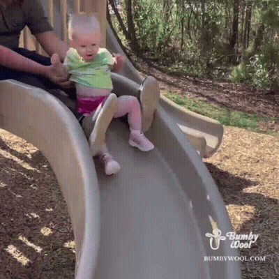A Baby Is Sliding Down A Slide With Bumpywool.com Written On The Bottom GIF