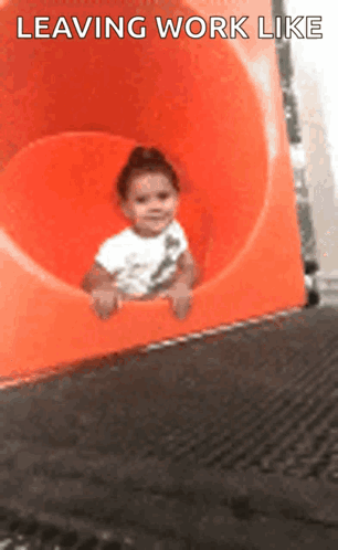 A Baby Is Sliding Down An Orange Slide With The Words Leaving Work Like Written On The Bottom GIF