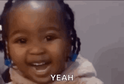 A Baby Is Smiling And Saying Yeah In A Video . GIF