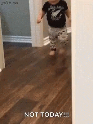 A Baby Is Walking On A Wooden Floor And Says Not Today !!! GIF