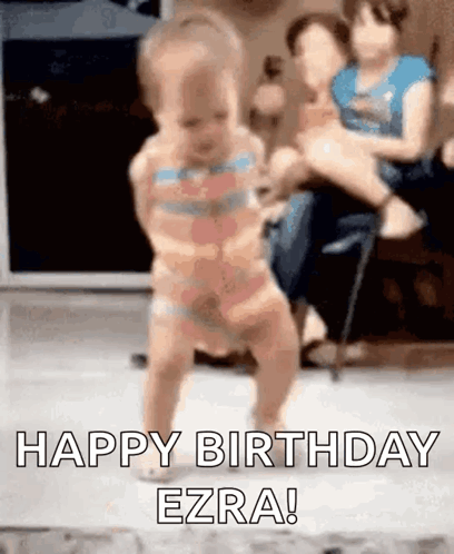A Baby Is Walking On The Floor With The Words `` Happy Birthday Ezra '' . GIF