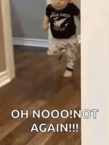 A Baby Is Walking Through A Doorway And Saying `` Oh Nooo ! Not Again !! '' GIF