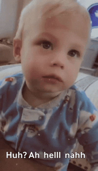 A Baby Is Wearing A Blue Outfit And Says Huh ? Ah Helll Nahh GIF