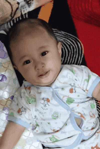 A Baby Is Wearing A Shirt That Says Tigger GIF