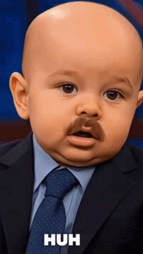A Baby Is Wearing A Suit And Tie And Has A Mustache GIF