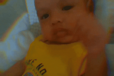 A Baby Is Wearing A Yellow Shirt That Says " Wake No " GIF