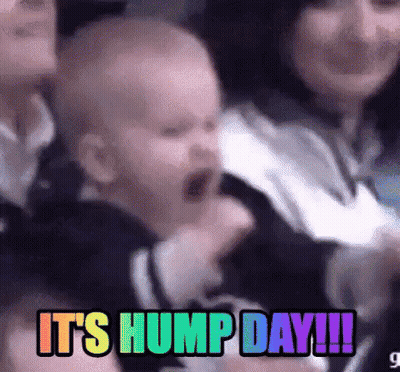 A Baby Is Yawning In A Crowd Of People With The Words `` It 'S Hump Day !!! '' GIF