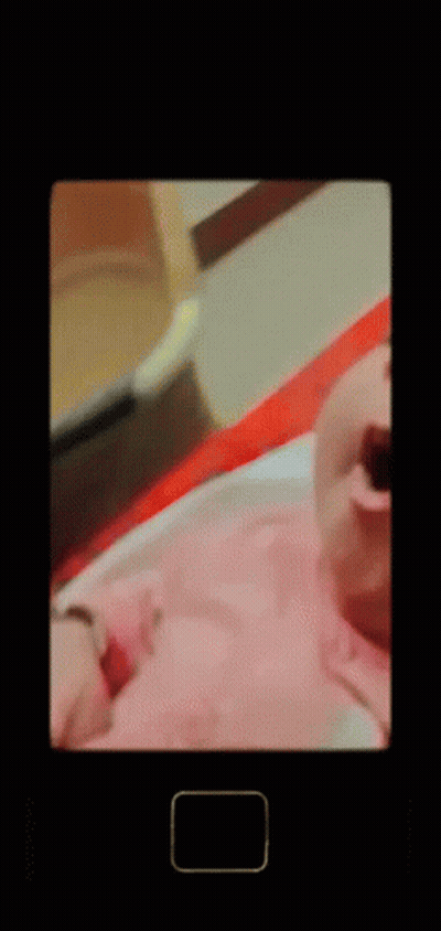 A Baby Is Yawning With A Square In The Corner GIF