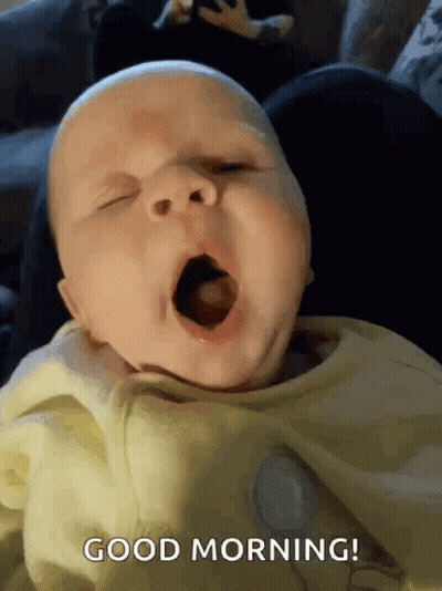 A Baby Is Yawning With The Words Good Morning Written In The Corner GIF