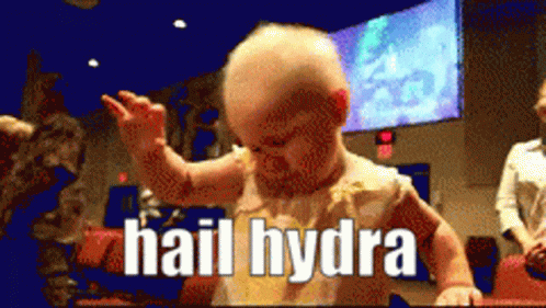A Baby Says Hail Hydra In A Blurry Photo GIF