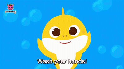 A Baby Shark Says " Wash Your Hands " In Front Of A Blue Background GIF