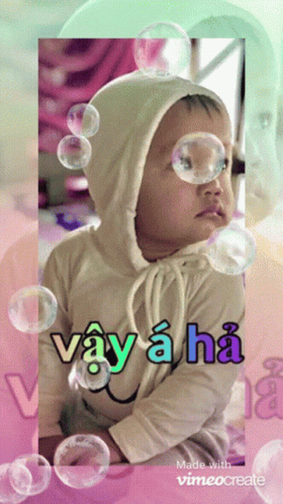 A Baby Surrounded By Soap Bubbles With The Words Vay A Ha GIF
