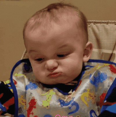 A Baby Wearing A Bib That Says Omg On It GIF