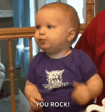 A Baby Wearing A Purple Weber State Shirt Says You Rock GIF