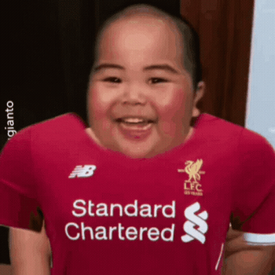 A Baby Wearing A Red Shirt That Says Standard Chartered On It GIF
