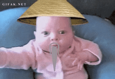 A Baby Wearing A Straw Hat And A Fake Mustache Is Sitting On A Blue Pillow .. GIF