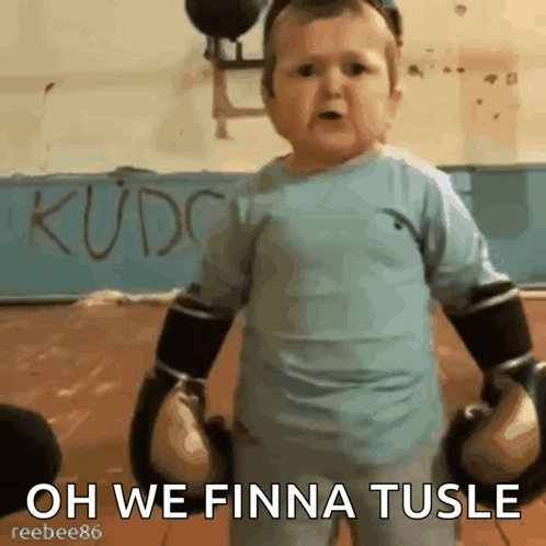 A Baby Wearing Boxing Gloves With The Words Oh We Finna Tusle On The Bottom GIF