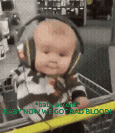 A Baby Wearing Headphones Is In A Shopping Cart With The Words Baby Accent Baby Now We Got Bad Blood GIF
