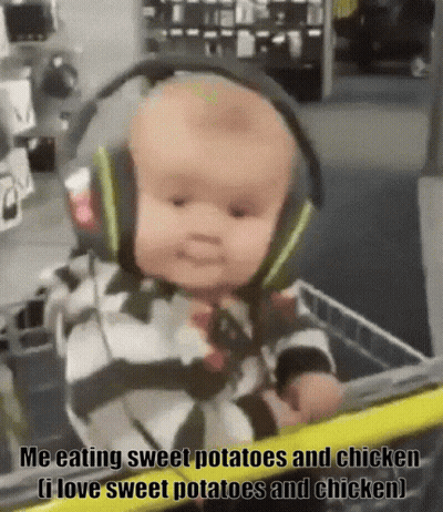 A Baby Wearing Headphones Is Sitting In A Shopping Cart With The Caption " Me Eating Sweet Potatoes And Chicken " GIF