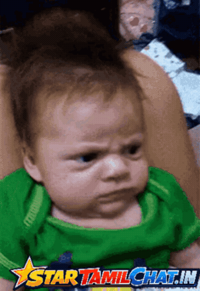 A Baby With An Angry Look On His Face Is On A Star Tamil Chat.in Advertisement GIF