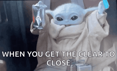 A Baby Yoda From Star Wars Is Holding A Bag Of Food And A Toothbrush . GIF
