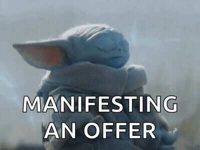 A Baby Yoda From The Mandalorian Is Manifesting An Offer With Its Eyes Closed GIF
