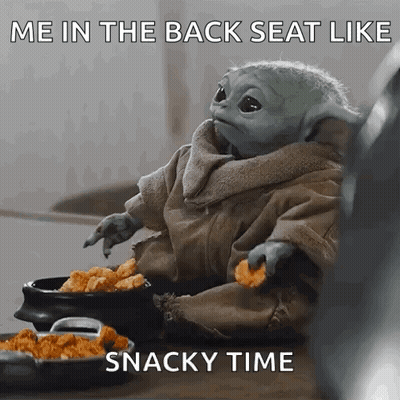 A Baby Yoda Is Sitting On A Table Eating Chicken Nuggets And A Snacky Time Meme . GIF