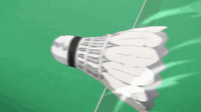A Badminton Shuttlecock Is Flying Through The Air With Chinese Writing Behind It GIF