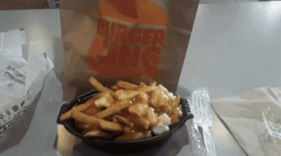 A Bag Of Burger King French Fries Sits On A Table GIF