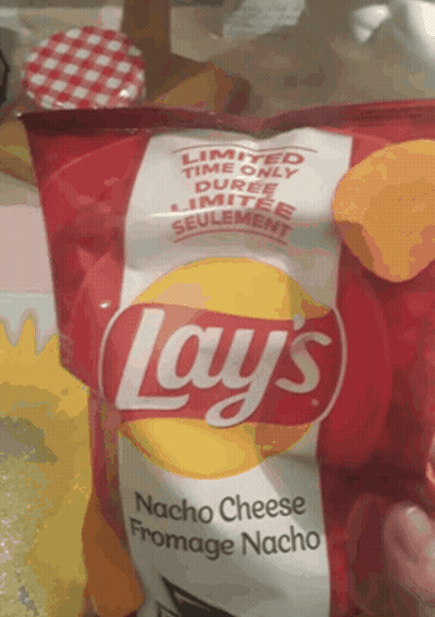 A Bag Of Lays Nacho Cheese Fromage Nacho Chips On A Table GIF