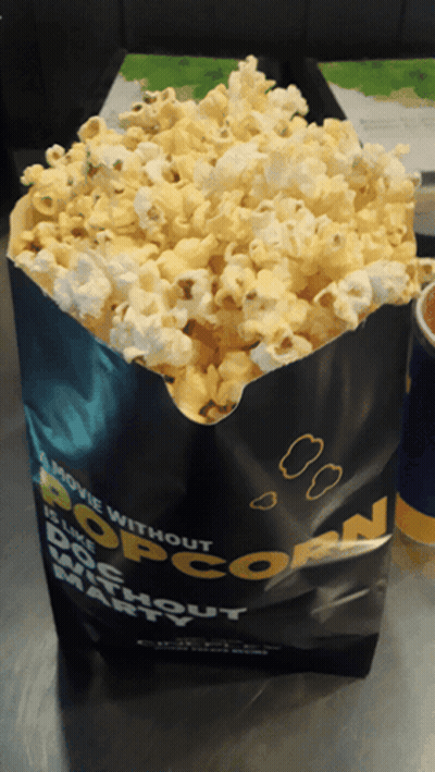 A Bag Of Popcorn Says A Movie Without Popcorn GIF