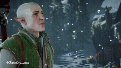 A Bald Elf In A Green Vest Is Standing In A Snowy Forest . GIF