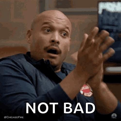 A Bald Man Clapping His Hands With The Words Not Bad Written Below Him GIF