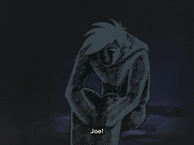 A Bald Man In A Black Suit Is Standing In Front Of A Door GIF