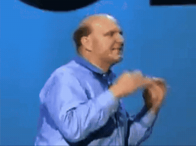 A Bald Man In A Blue Shirt Is Dancing With The Word Expeditions Written On His Shirt GIF