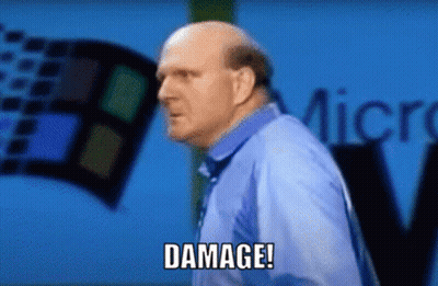 A Bald Man In A Blue Shirt Says Damage In Front Of A Windows Logo GIF